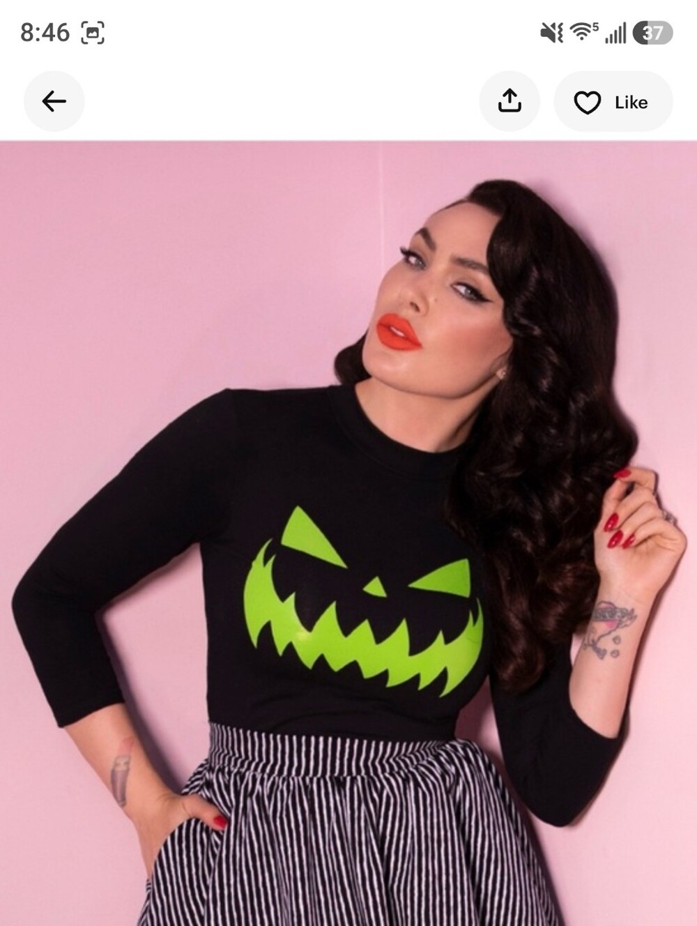Vixen Micheline Pitt. Black Halloween Pumpkin Face Sweater - Green Print